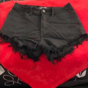 Black fringe jean shorts